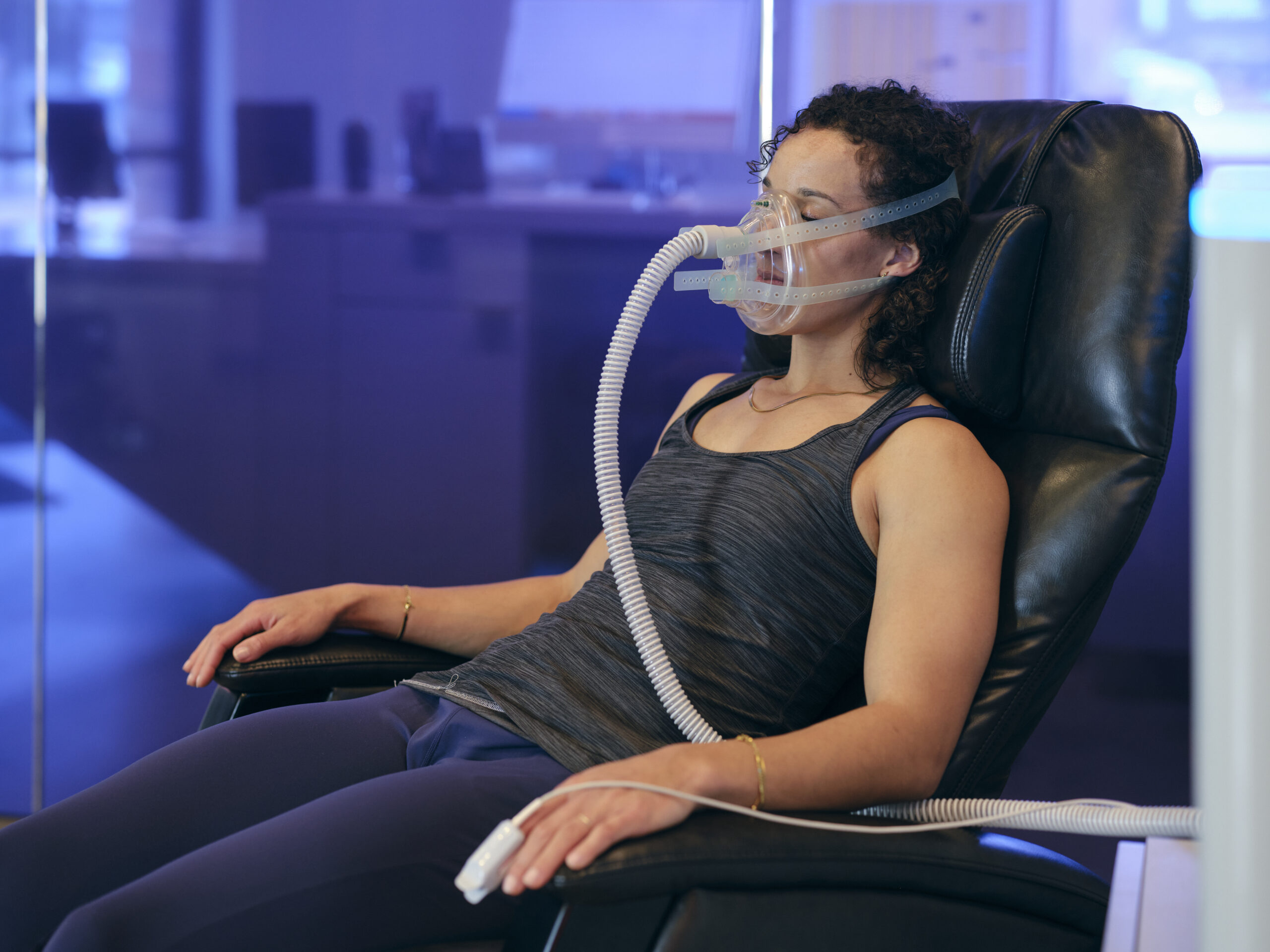 Woman using the Metabolic Oxygen Trainer.