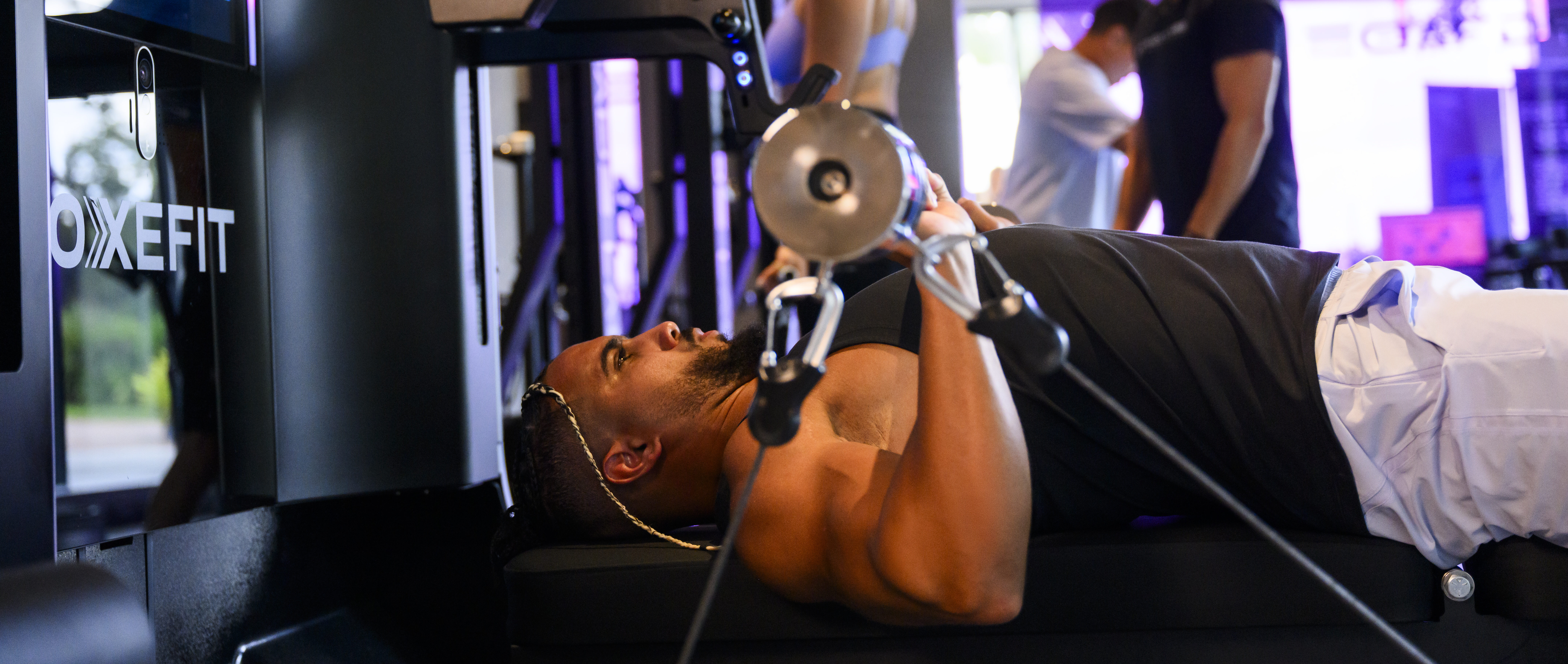 Man doing a chest press on the AI Strength Trainer.